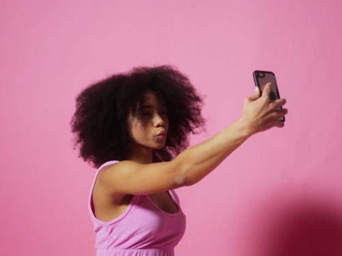 A Young Girl Taking A Selfie