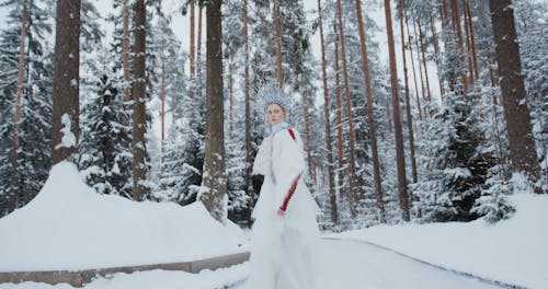 A Woman Wearing a White Fur Coat and a Silver Headdress