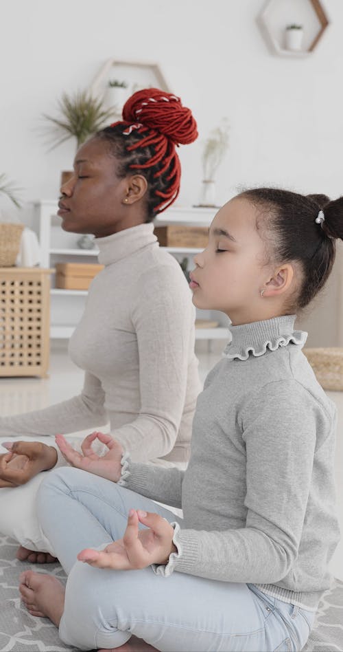 Woman and Girl Meditating