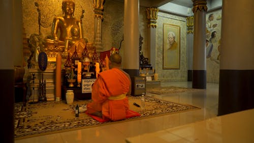 Monk Praying to Buddha