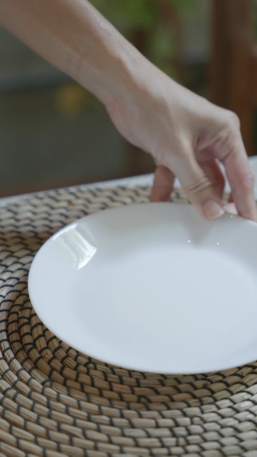A Person Setting a Table