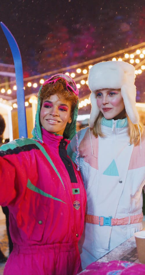 Two Smiling Women in Skiing Outfit Taking Selfie