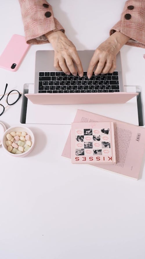 Elderly Woman Typing on Laptop Keyboard