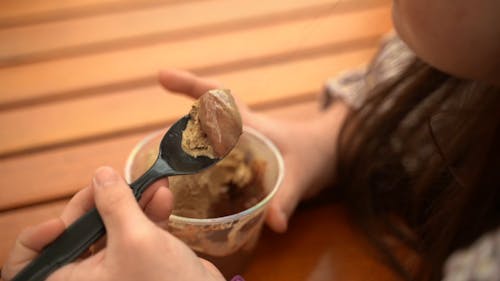 A Woman Eating Ice Cream