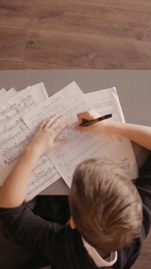 A Boy Studying Music