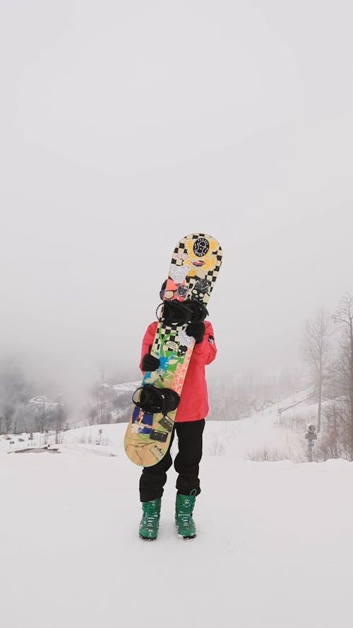 Man Posing With Snowboard