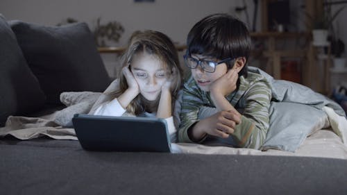 Siblings Using a Tablet