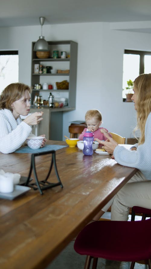 Women Eating with a Child