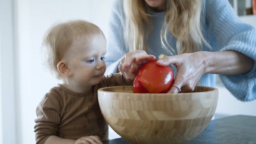 Mother and Child Washing a Bell Pepper