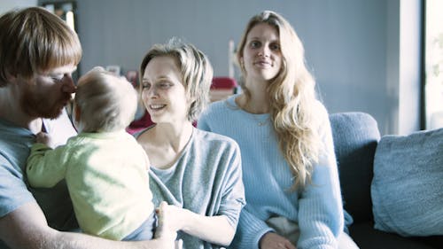 A Family Talking to Their Baby