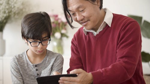 Close-Up View of Father and Son Spending Time Together