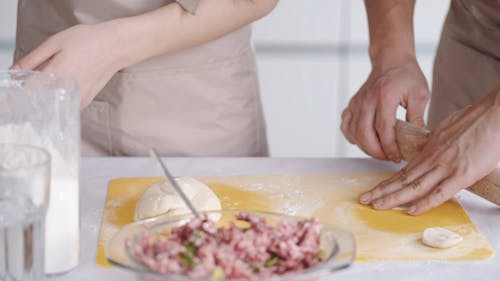 A Couple Preparing A Dim Sum