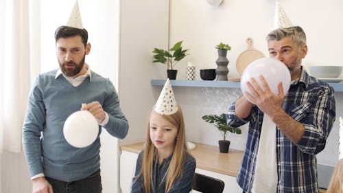 A Family Celebrating In A Birthday Party Together