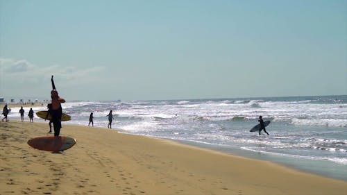 Panning Shot of People in the Seashore