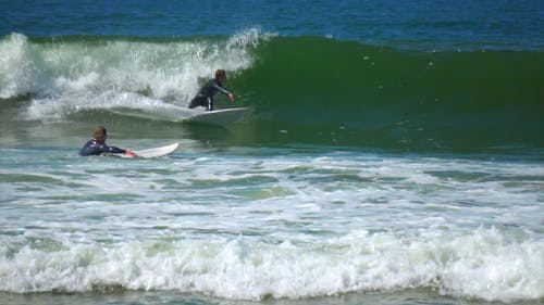 A Man Surfing on the Waves