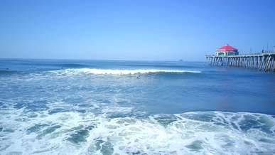 aerial footage of people surfing on sea waves