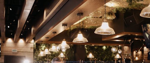 Man on a Bar Drinking Whiskey while Calling using Smartphone