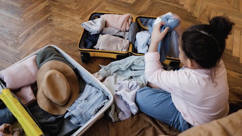 A Girl Packing Clothes