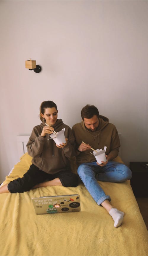 Couple Smiling while Eating