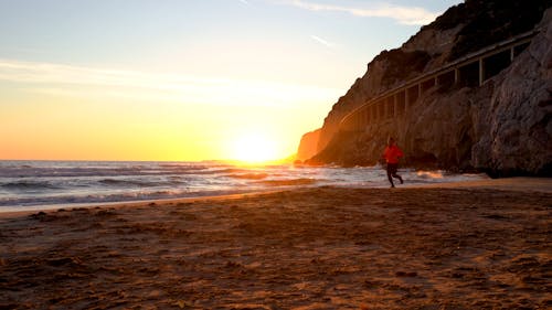 A Person Running on the Seashore