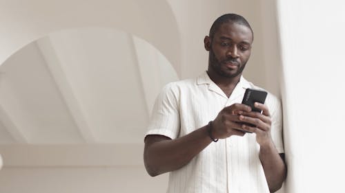 Man Texting in a Phone