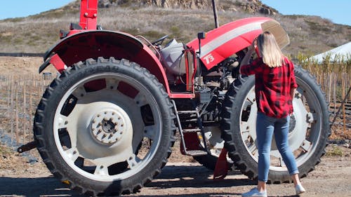 Woman Looking a Tractor