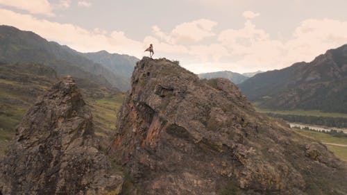Aerial footage of a Person on a Crag