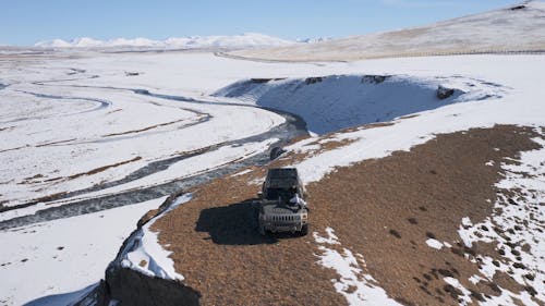 A Jeep Car Off-road on the Snow