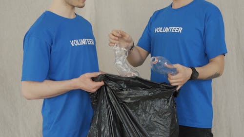 Men Collecting Plastic Bottles