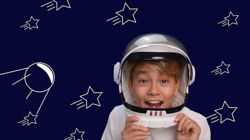 Happy Child in Astronaut Helmet