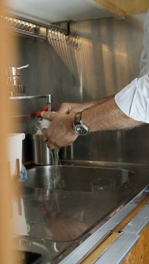 Man Washing the Cup