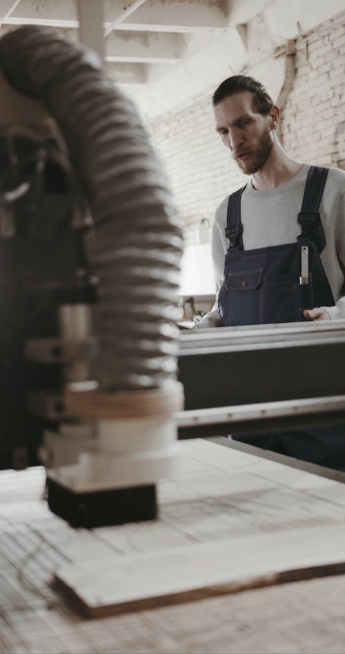 Man Operating CNC Machine