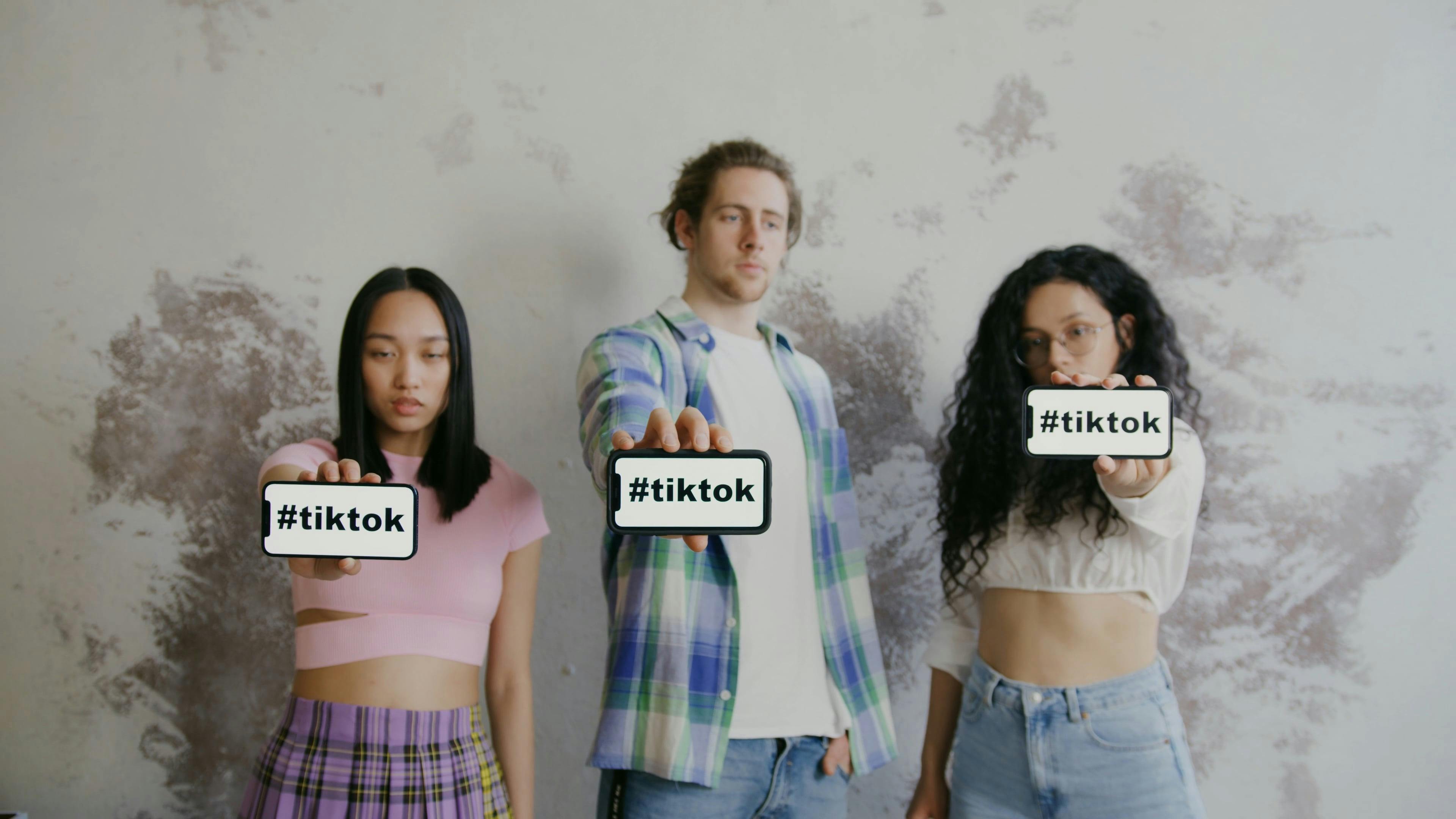 Friends with Messages on Their Cellphone Screens · Free Stock Video