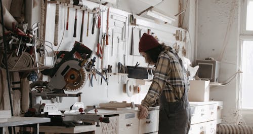 A Man Working while Wearing a Beanie