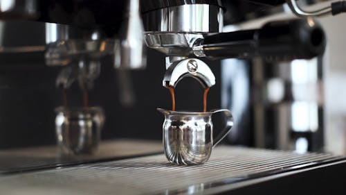 Coffee Dripping into a Small Chrome Pot