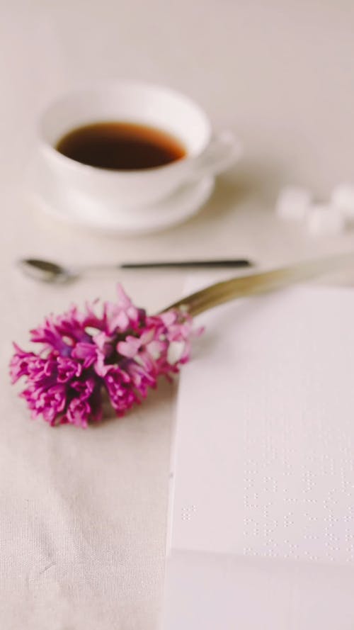 A Person Putting Sugar in the Coffee