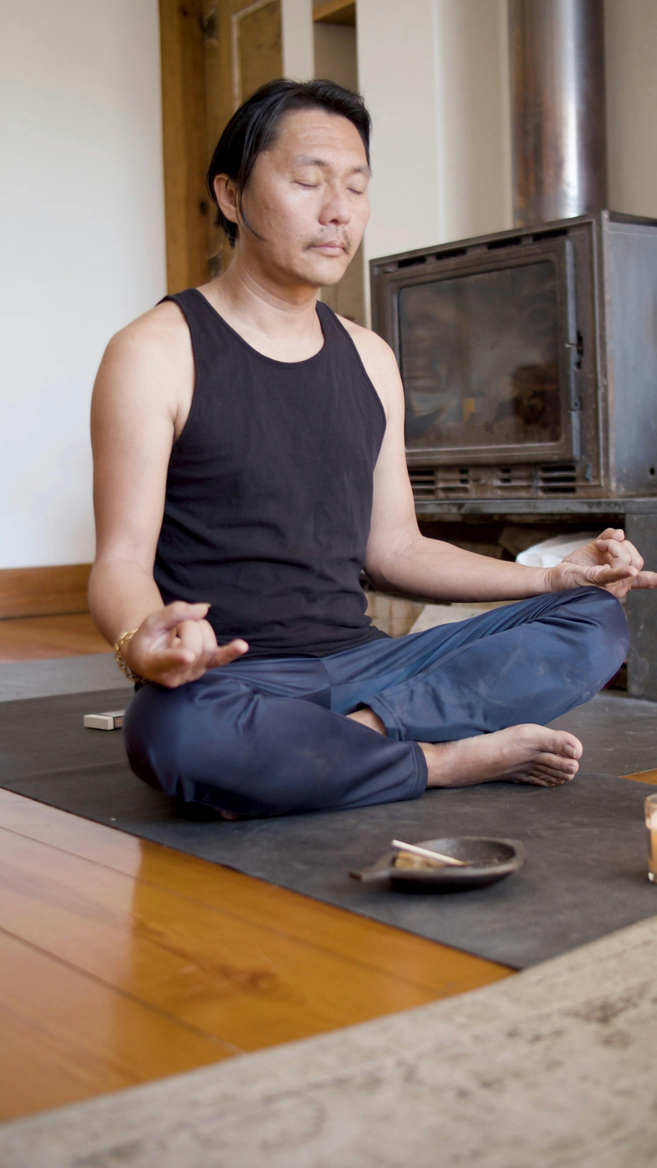 A Man Meditating while Burning Incense · Free Stock Video