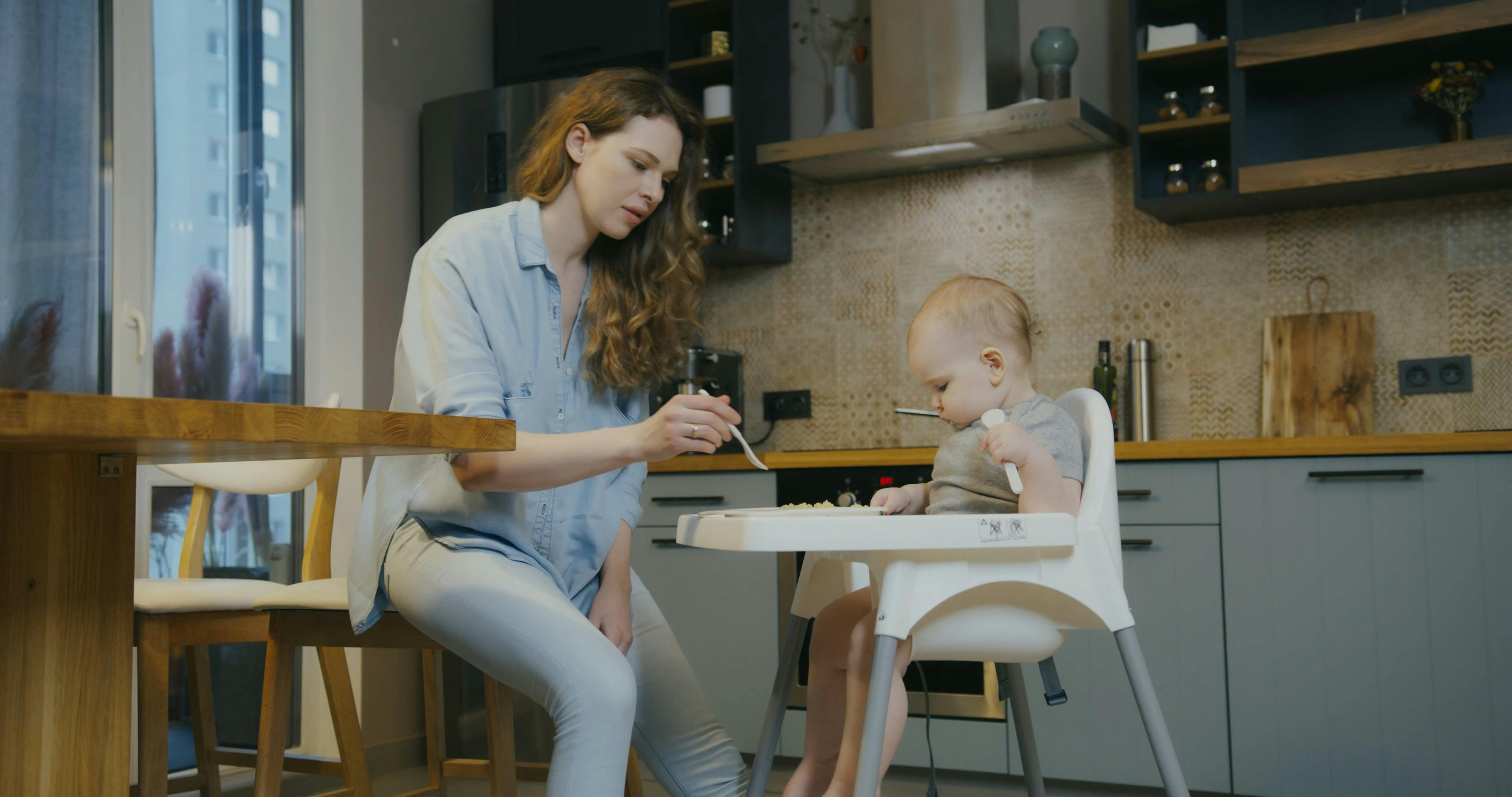 Mother Teaching Baby How to Eat · Free Stock Video