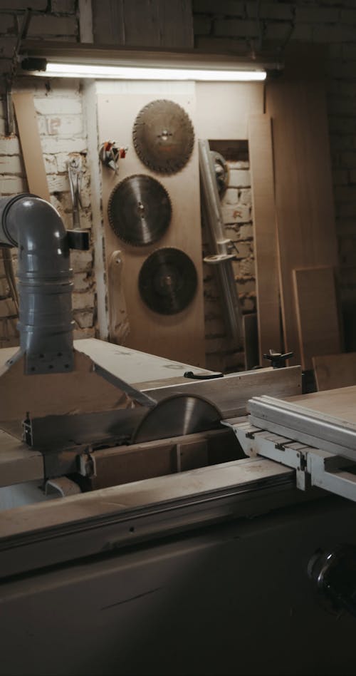 A Carpenter Cutting Wood with a Circular Saw