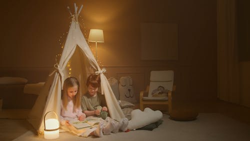 Sibling Reading a Book