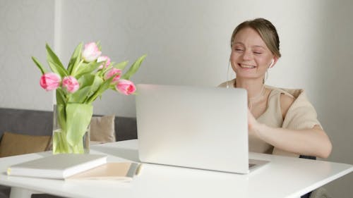 A Beautiful Woman on a Video Call on Her Laptop
