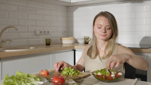 A Woman Preparing a Salad