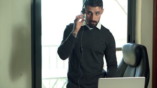 A Man Talking on a Headset