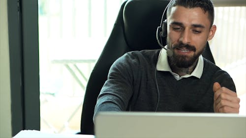 A Call Center Agent Talking on a Headset
