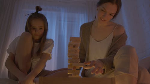 Mom and Daughter Playing Jenga