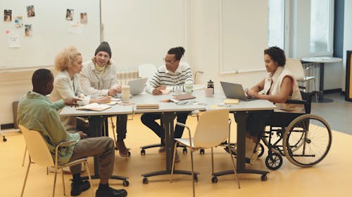 People Chatting during a Meeting