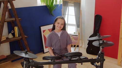 Girl with an Electronic Drum Set