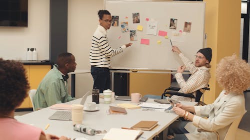 Men Presenting at a Meeting