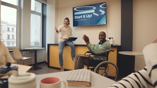 Team Clapping their Hands while having a Meeting