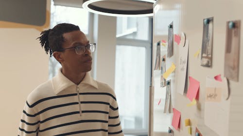 Man Looking at a Whiteboard during a Presentation 